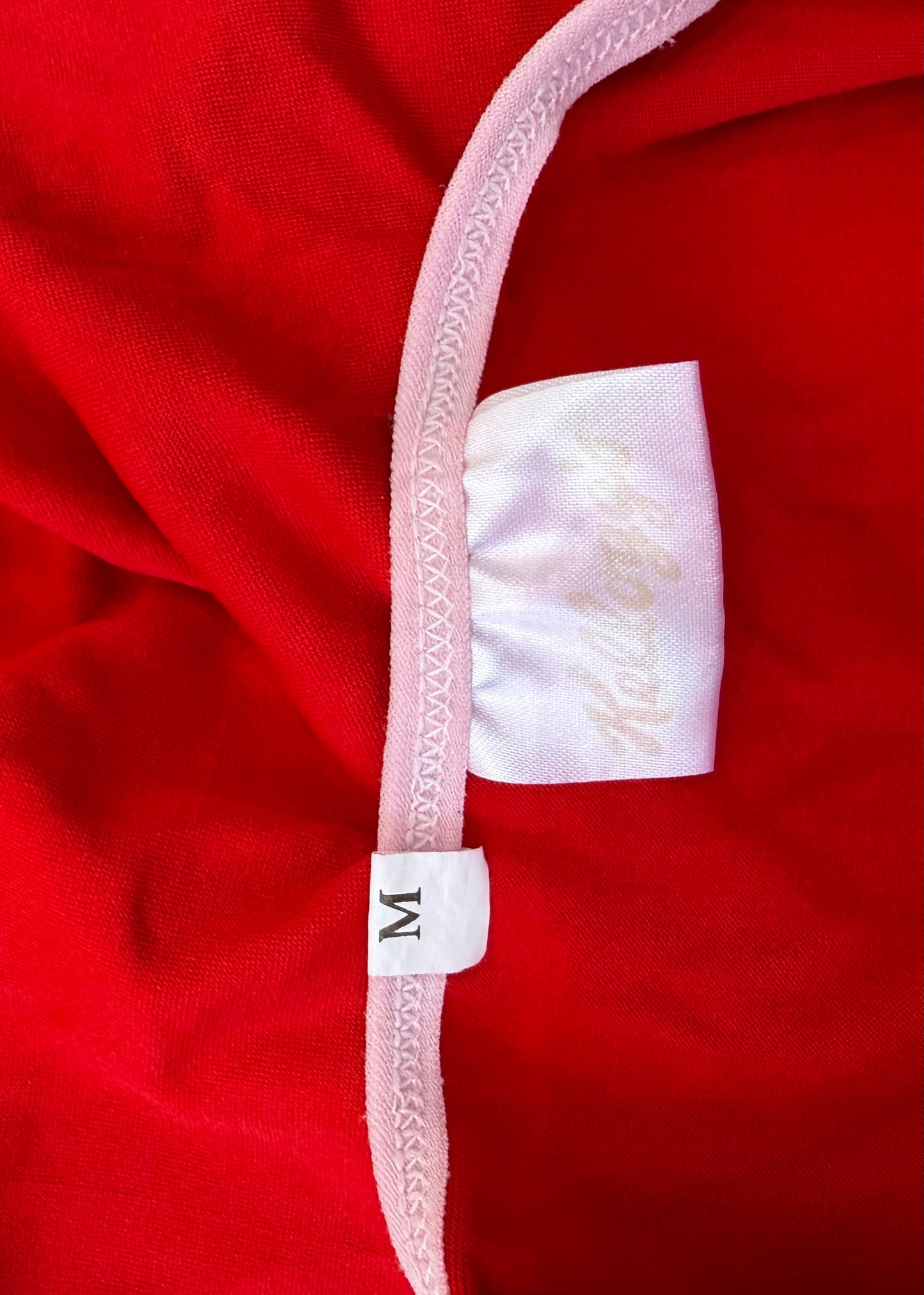 small red cami top with white detailing