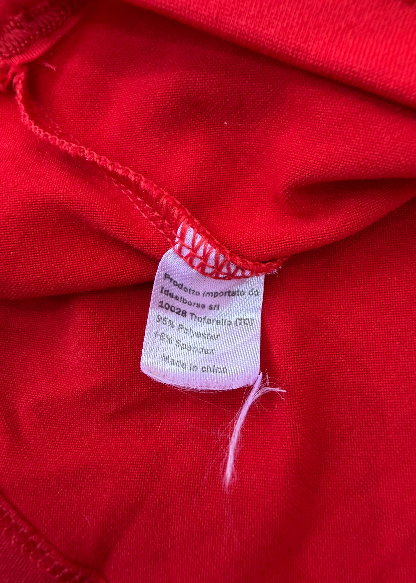 small red cami top with white detailing