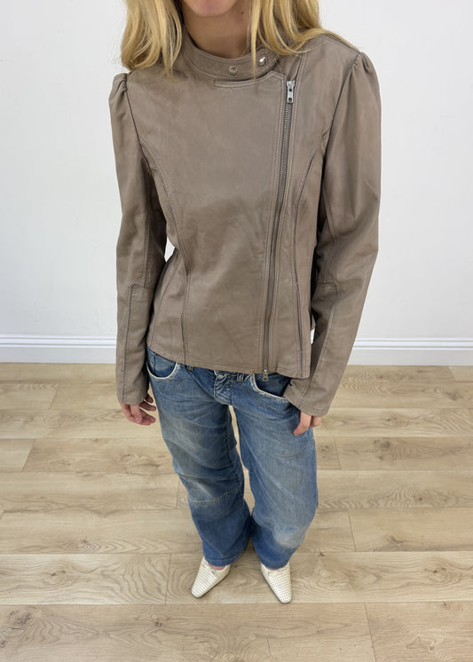 small beige asymmetric leather jacket aesthetic detail