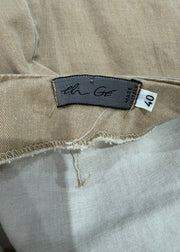 small beige midi skirt with eyelet detail care label