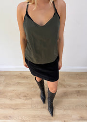 small black corduroy mini skirt posed