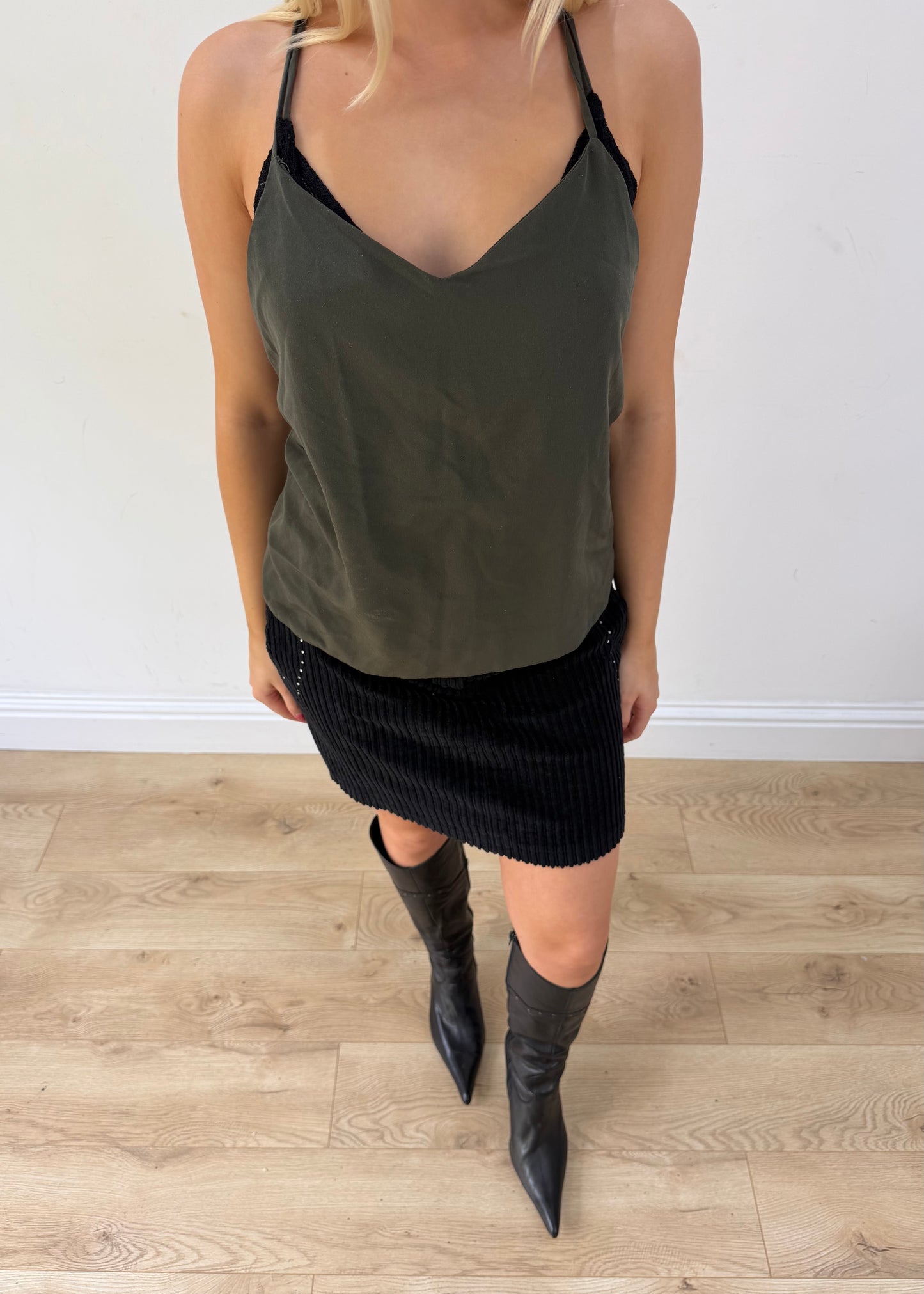 small black corduroy mini skirt posed