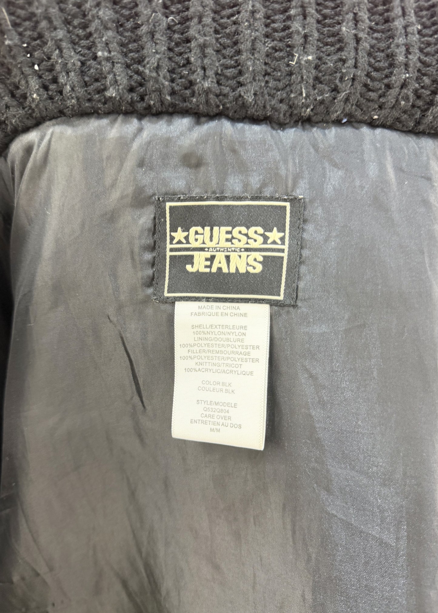small black guess quilted puffer jacket label
