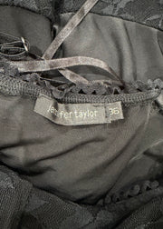 small black mesh bolero cardigan care label