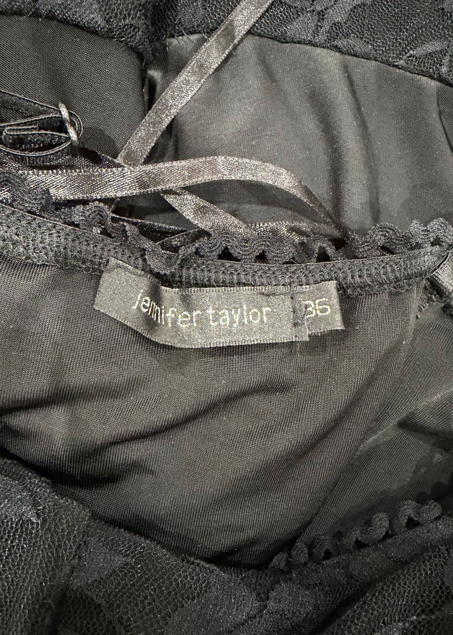 small black mesh bolero cardigan care label
