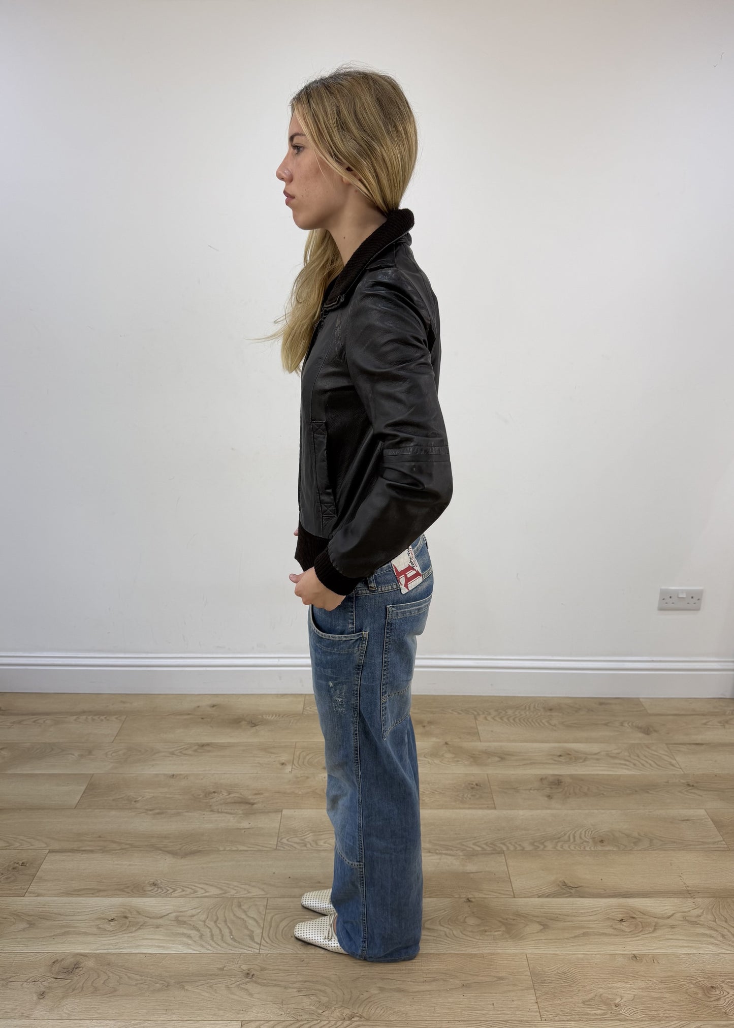 small dark brown zara faux leather jacket left side