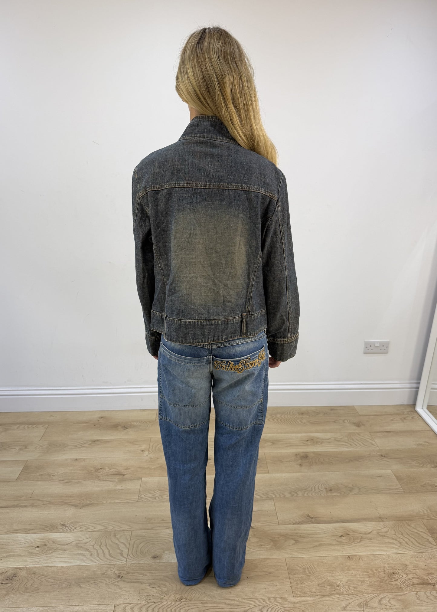 small grey acid wash denim jacket back