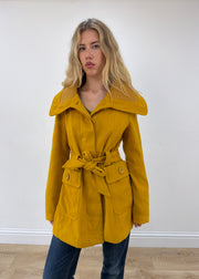 small yellow belted trench coat front close-up