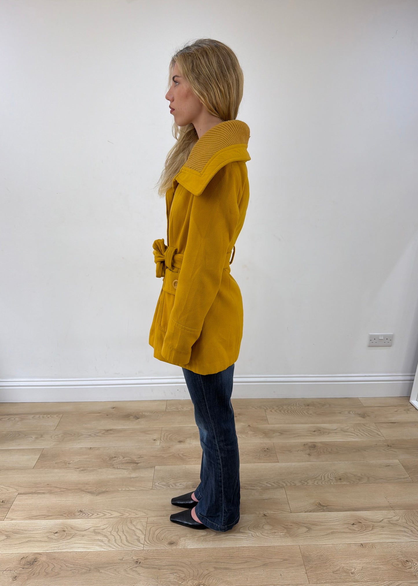 small yellow belted trench coat side view