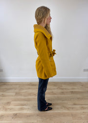 small yellow belted trench coat opposite side view