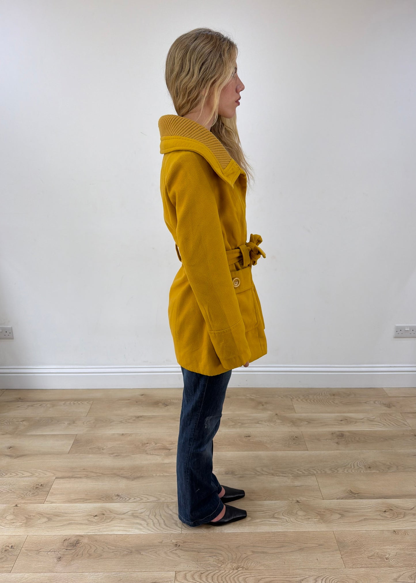 small yellow belted trench coat opposite side view