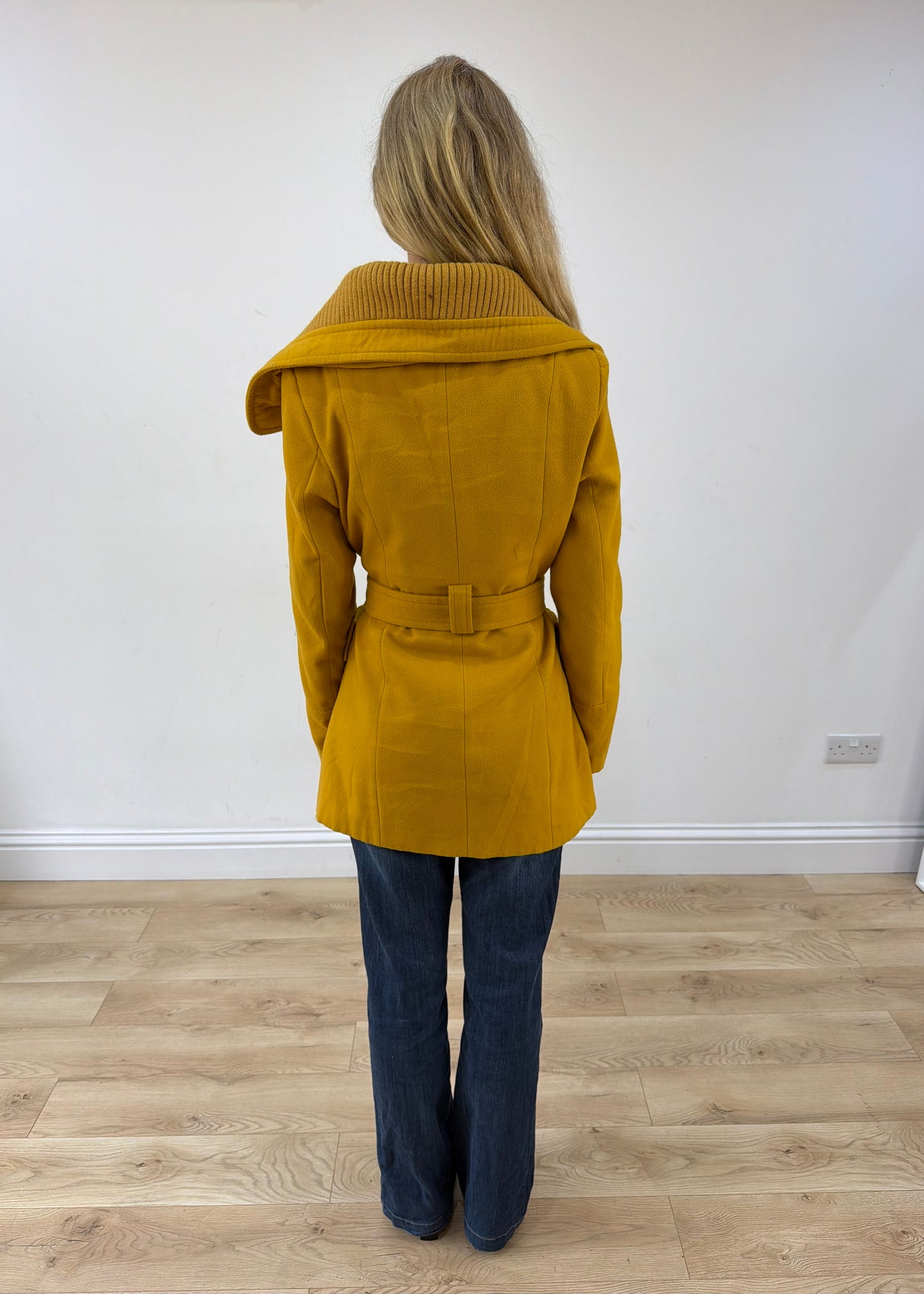 small yellow belted trench coat back view