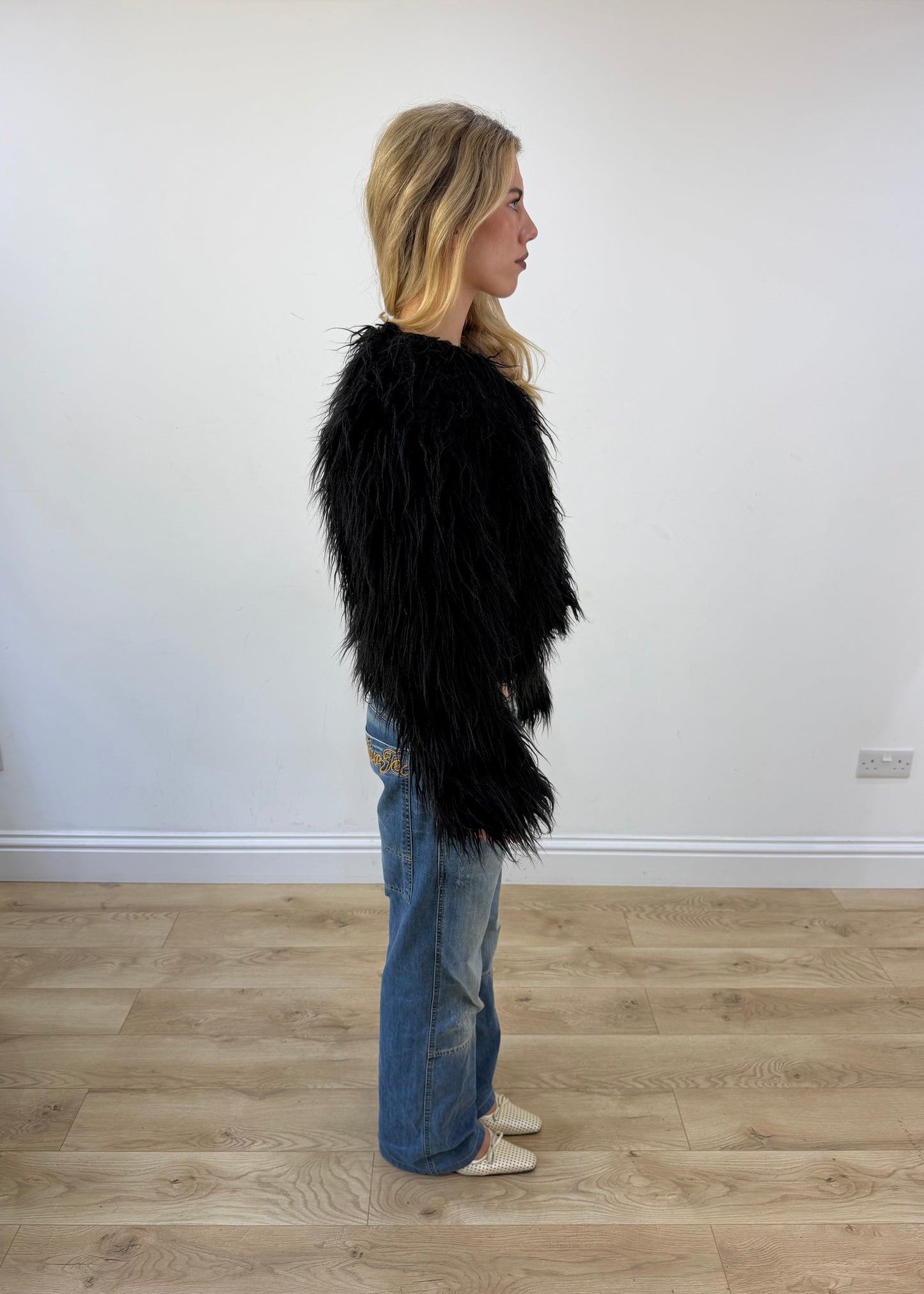 small black coocu shag fur jacket opposite side