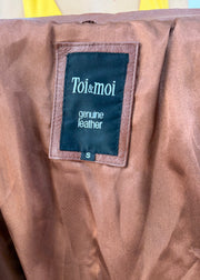 small brown toi and moi leather trench coat label detail