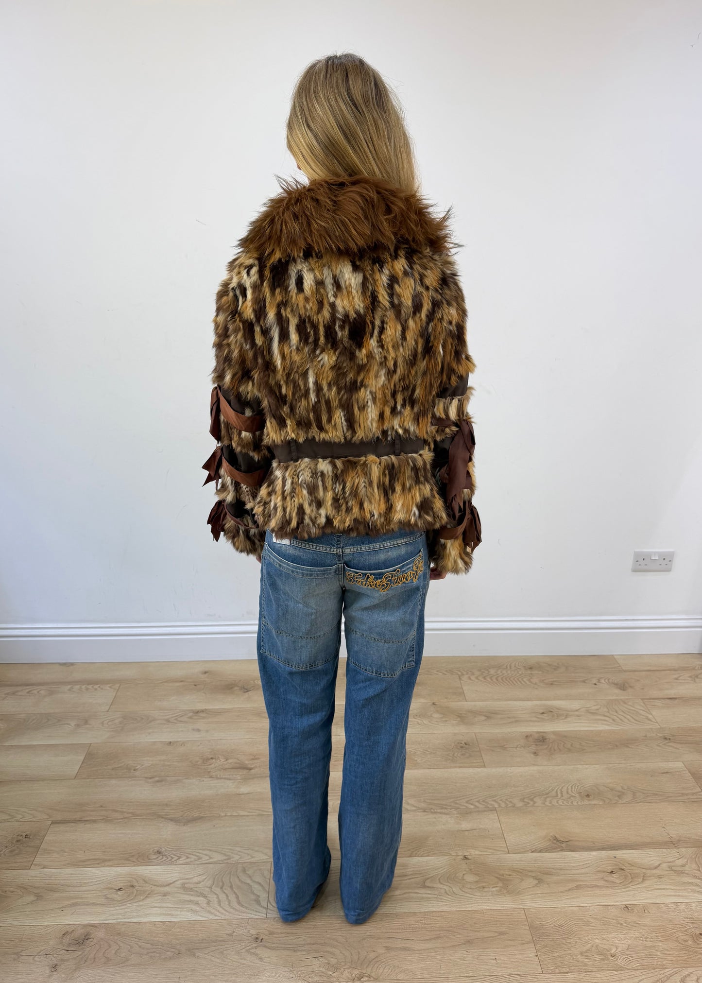 small brown toi and moi mixed fur jacket back