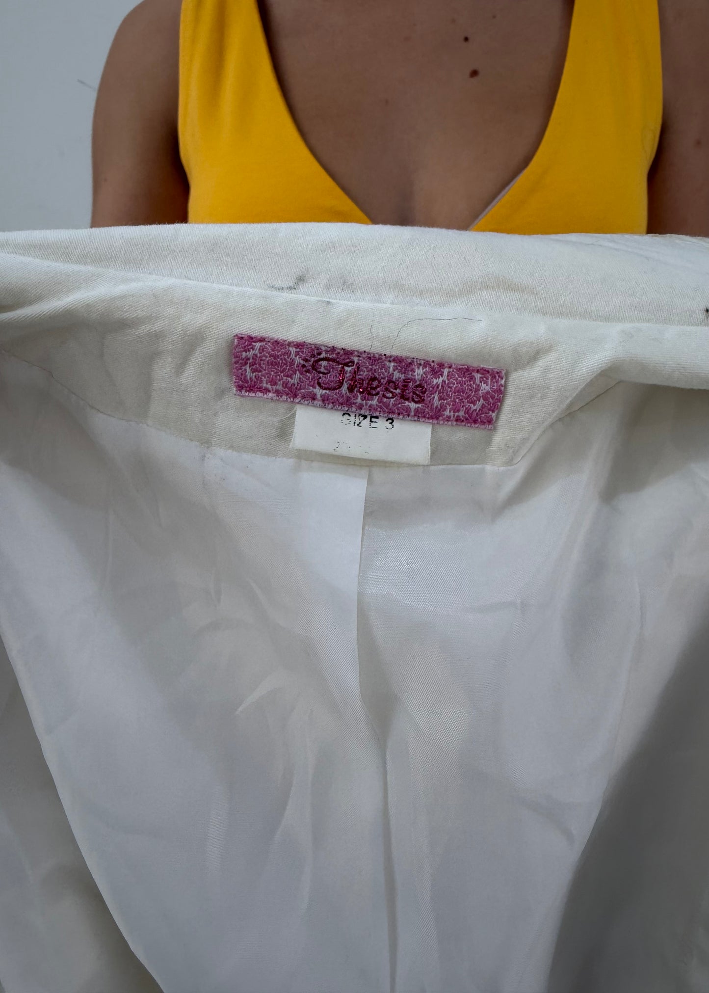 small white belted blazer label detail
