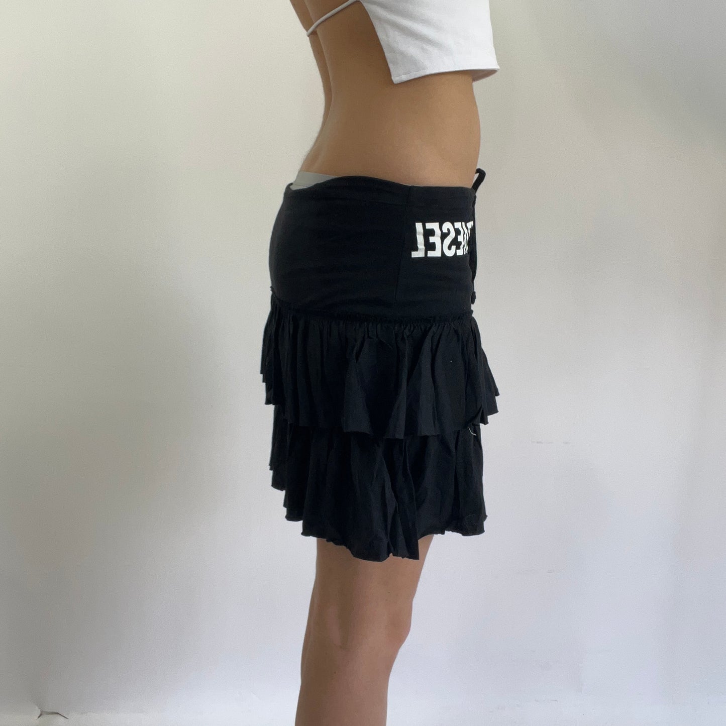 black ruffle skirt with diesel spell out