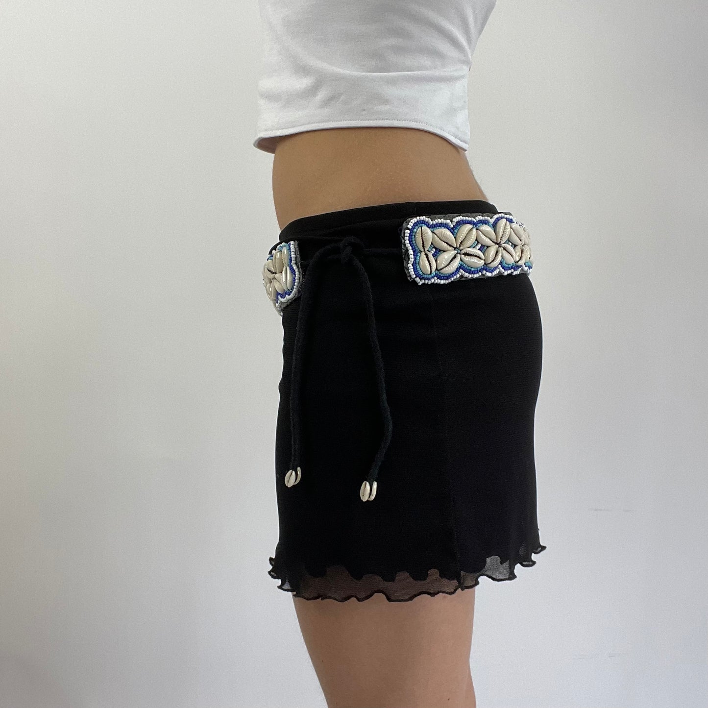 white and blue shell belt