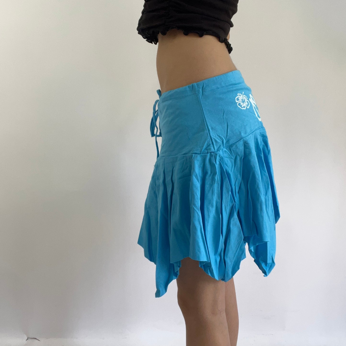 💻‼️ small baby blue billabong asymmetric skirt with white spell out on the bum