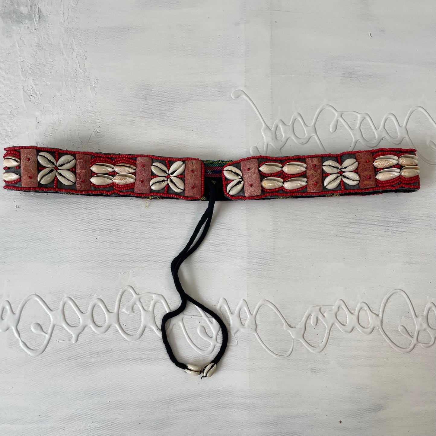 red and white shell belt