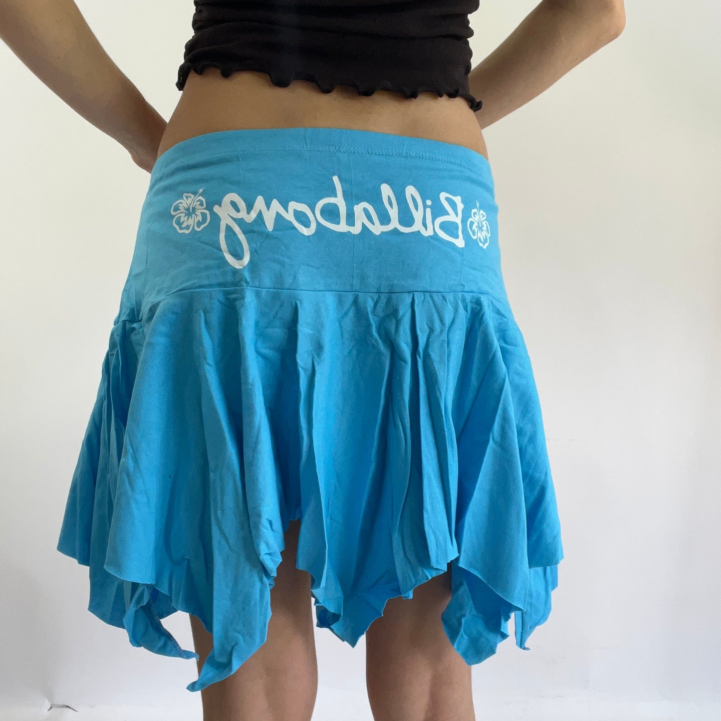 💻‼️ small baby blue billabong asymmetric skirt with white spell out on the bum