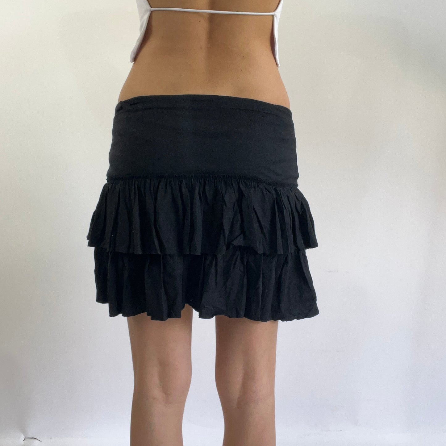 black ruffle skirt with diesel spell out