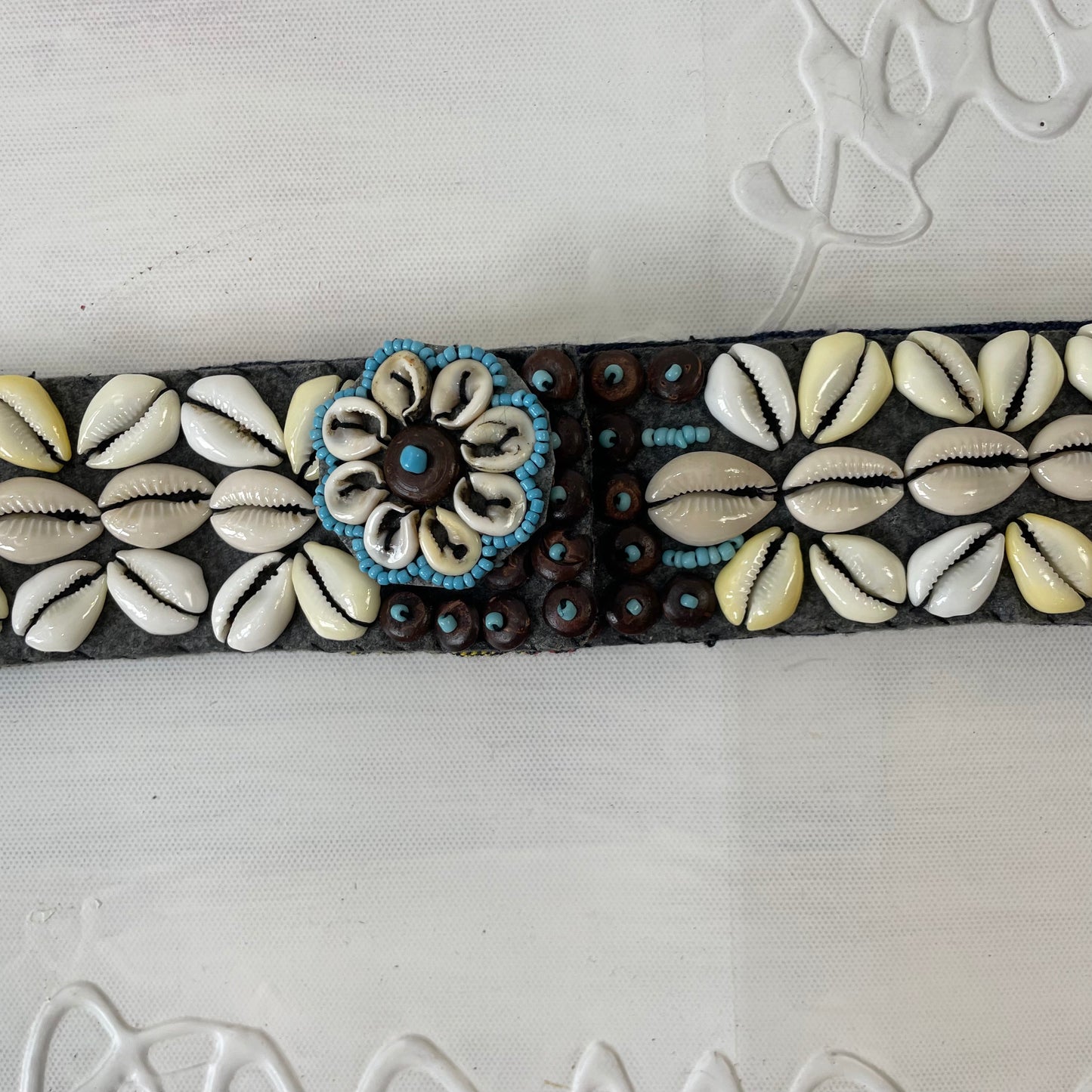 brown, blue and cream shell belt