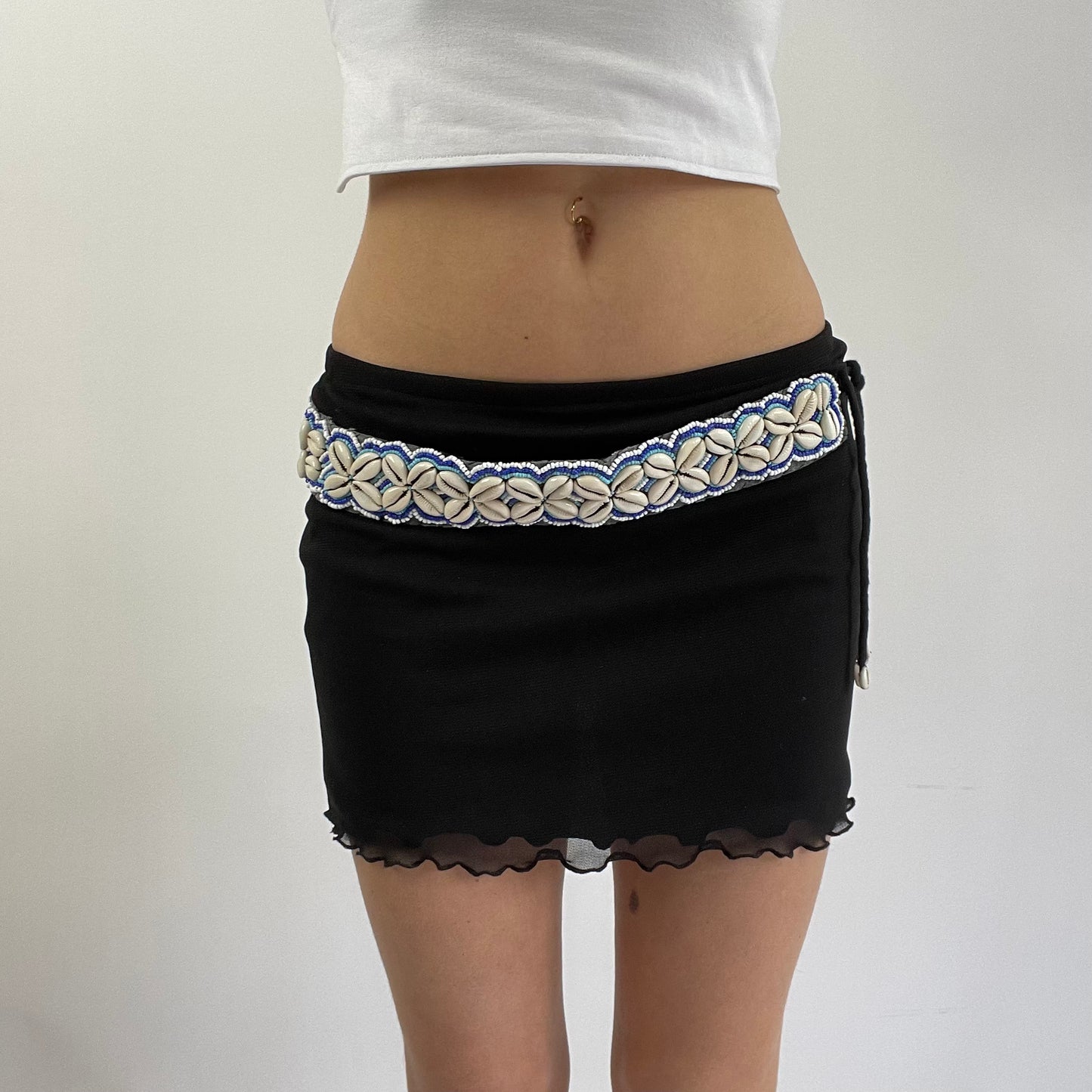 white and blue shell belt